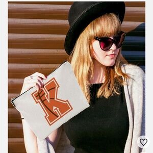 White Pouch with Orange Letter K